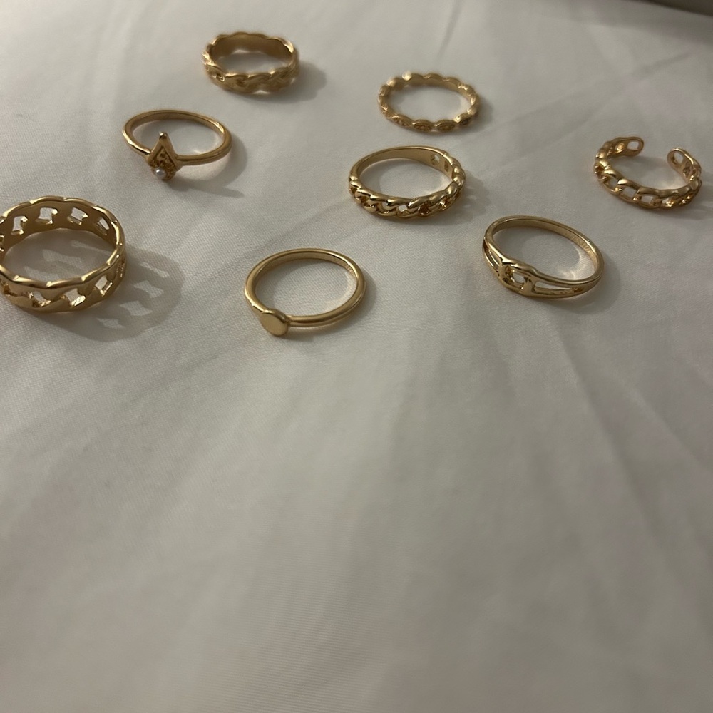 Plated gold knot rings (8)